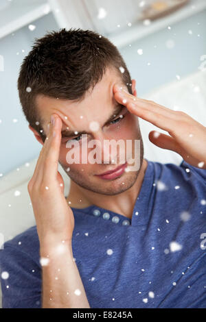 Depressed man having a headache Stock Photo