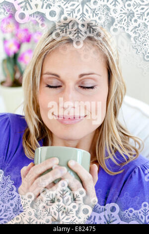 Attractive young woman enjoying her coffee Stock Photo