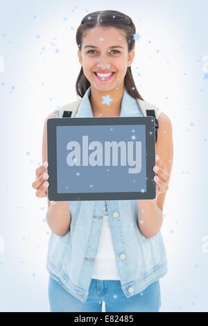 Pretty student showing her tablet pc Stock Photo