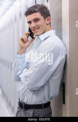 Portrait of a smiling technician on the phone Stock Photo