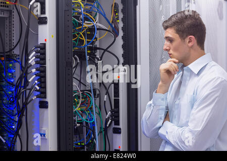 Technician searching for a solution in the server case Stock Photo