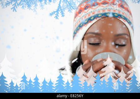 Young woman enjoying a cup of tea in the cold Stock Photo