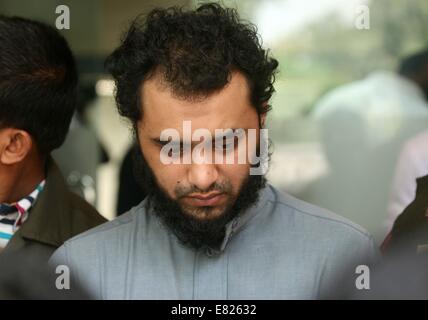 Bangladeshi police present Samiun Rahman , a British citizen of Bangladeshi origin, on suspicion of ties with global jihadist organizations in Dhaka on September 29, 2014. Bangladesh police said September 29 they arrested a British citizen suspected of entering the country to recruit militants for jihadist groups overseas such as the Islamic State organization. Stock Photo