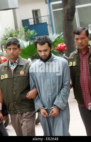 Bangladeshi police present Samiun Rahman , a British citizen of Bangladeshi origin, on suspicion of ties with global jihadist organizations in Dhaka on September 29, 2014. Bangladesh police said September 29 they arrested a British citizen suspected of entering the country to recruit militants for jihadist groups overseas such as the Islamic State organization. Stock Photo