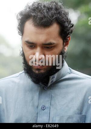 Bangladeshi police present Samiun Rahman , a British citizen of Bangladeshi origin, on suspicion of ties with global jihadist organizations in Dhaka on September 29, 2014. Bangladesh police said September 29 they arrested a British citizen suspected of entering the country to recruit militants for jihadist groups overseas such as the Islamic State organization. Stock Photo