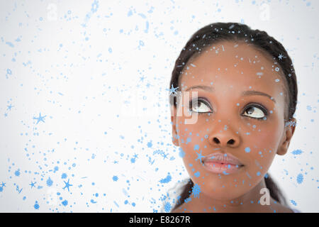 Close up of womans face looking upwards diagonally on white background Stock Photo