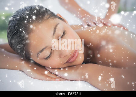 Beautiful brunette enjoying a massage Stock Photo
