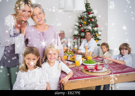 Composite image of three generations of women at christmas time Stock Photo