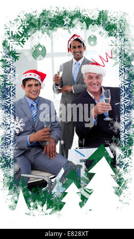 Composite image of confident businessmen wearing novelty christmas hat Stock Photo