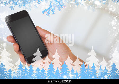 Womans hand holding black smartphone Stock Photo