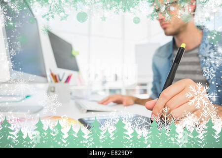 Casual male photo editor using graphics tablet Stock Photo
