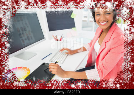 Casual female photo editor using computer Stock Photo