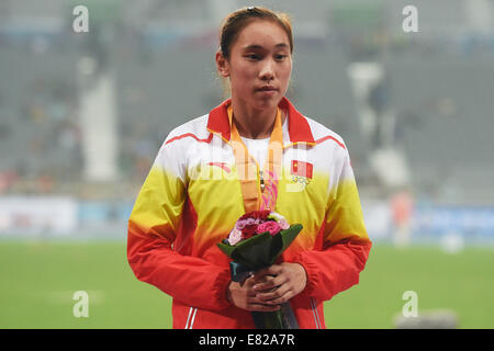 Incheon, South Korea. 29th Sep, 2014. Silver medalist Wang Qingling of China poses on the podium during the awarding ceremony of the women's heptathlon of athletics at the 17th Asian Games in Incheon, South Korea, Sept. 29, 2014. © Gong Lei/Xinhua/Alamy Live News