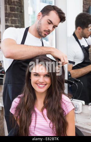Handsome hair stylist with client Stock Photo