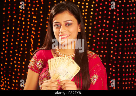 indian ladies diwali Festival Showing Money Stock Photo