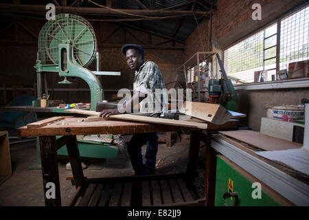 Rwandan carpenter in his workshop, Kigali, Rwanda. Stock Photo
