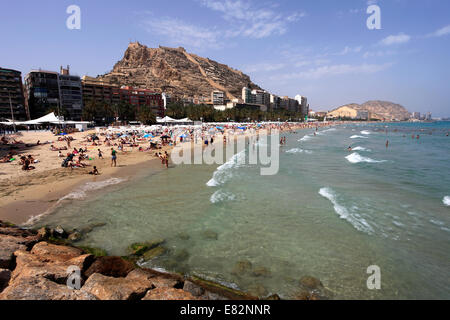 Sunbathers on the beach at Alicante City, capital of Valencia region, Spain, Europe. Stock Photo