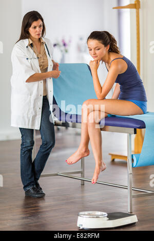 Teenage girl and doctor. Stock Photo