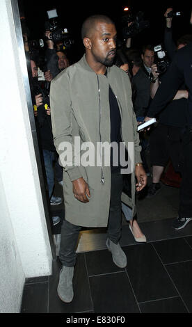 Kanye West and Kim Kardashian arrive at Los Angeles International (LAX) airport  Featuring: Kanye West Where: Los Angeles, California, United States When: 24 Mar 2014 Stock Photo