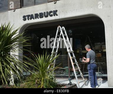 The former headquarters of Anglo Irish Bank on St Stephen’s Green has new Starbucks sign erected in place where the old infamous Anglo sign was located. For many, the Anglo Irish Bank sign was a symbol synonymous with The Celtic Tiger and the subsequent harsh economic climate & recession in Ireland in recent years - its removal made both national and international news headlines  Featuring: Starbucks Where: Dublin, Ireland When: 25 Mar 2014 Stock Photo