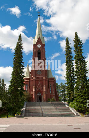 The Cathedral of red brick against the blue sky in the Finnish town of Mikkeli. Stock Photo
