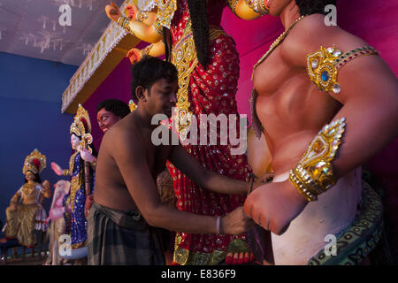 Dhaka, Bangladesh. 29th Sep, 2014. The Goddess Durga ready for the Durga Puja.Durga is the invincible Mother Goddess, riding a lion into battle. Created by the Gods when evil threatened the Universe, she is ''˜Shakti' the divine power to stand against, absorb and fight dark forces. Throughout worship, known as Puja, Hindu people celebrate the defeat of evil by Durga.Hindu God and Goddesses as the biggest festival of Hindu Believer named Durga Puja. Credit:  Zakir Hossain Chowdhury/ZUMA Wire/Alamy Live News Stock Photo