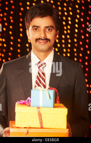 Christmas gift from colleague. Tradition giving gifts. Businessman excited  face hold gift box. Secret santa office tradition. Celebrate christmas  corporate party. Man formal suit hold gift box Stock Photo - Alamy