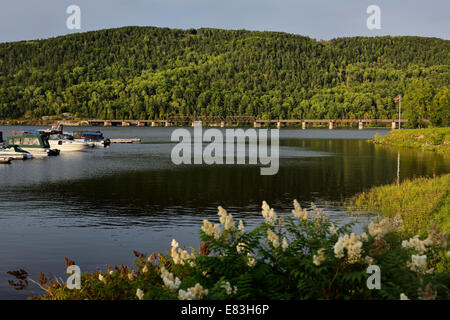 Train bridge over the Ottawa river to Quebec at Mattawa Explorers Point Park marina Ontario Canada Stock Photo