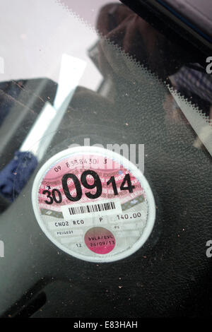 Exeter Uk 29 September 2014.  On October 1st tax disc will no longer be supplied to display on vehicles. Those renewing their road tax due to expire at the end of September will be the first to go 'Disc free' When this disc expires tomorrow it will not be replaced. Stock Photo