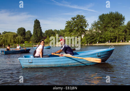 Young Sikh couple rowing on the boating lake in Regent's Park, London, England, UK Stock Photo