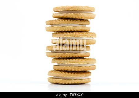 Stack of Vanilla cookies with cream filling on white background Stock Photo