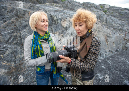 Senior female photographer in Alaska with daughter Stock Photo