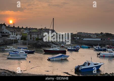 Sunset over Porth Amlwch harbour, Amlwch, Anglesey, Gwynedd, North Wales, UK Stock Photo