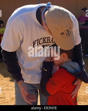 Jan. 31, 2009 - Spring Hill, FL, USA - ht 300748 free kick 1 of 6 Spring Hill, 2/1/09 --Greg Kopplow of Hudson, kickball coach and umpire with the Hernando County branch of the YMCA of the Suncoast, comforts his son, Dylan, 7, Saturday after Dylan was upset that Greg called Dylan out at the end of an inning. 1 of 6 photos (Credit Image: © St. Petersburg Times/ZUMA Wire) Stock Photo