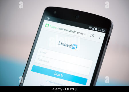 Close-up shot of brand new Google Nexus 5, powered by Android 4.4 version, with LinkedIn sign in website form on a screen. Stock Photo