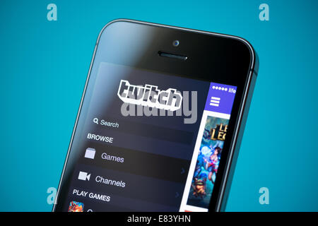Close-up shot of brand new Apple iPhone 5S with Twitch video streaming service application on a screen. Stock Photo