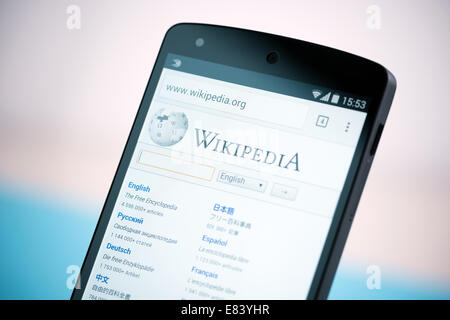 Close-up shot of brand new Google Nexus 5, powered by Android 4.4 version, with Wikipedia website homepage on a screen. Stock Photo