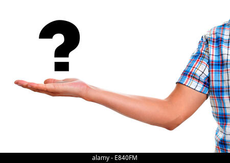 the hand of a young man holding a question mark on a white background Stock Photo