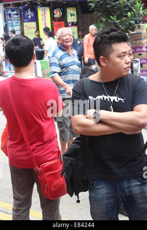 Hong Kong, 30 Sep, 2014.  Hong Kong Protests: An old man with a mainland Chinese accent hurls abuse at Hong Kong pro-democracy supporters. They are blocking Hennessy Road and Yee Wo Street in the busy shopping district of Causeway Bay to further their demand for full democracy. Credit:  Robert SC Kemp/Alamy Live News Stock Photo