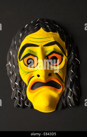 Scary halloween mask isolated on black background Stock Photo