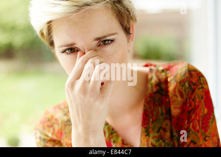 Girl with blocked sinuses Stock Photo