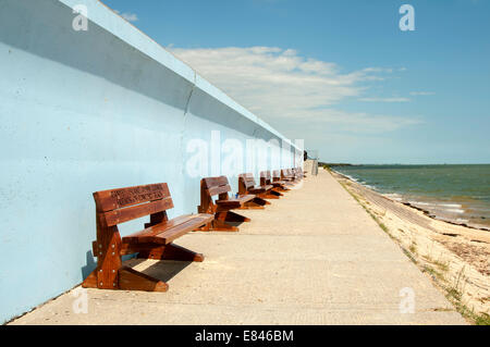 benches by the sea wall at Concord beach Canvey Island, Essex, England Stock Photo
