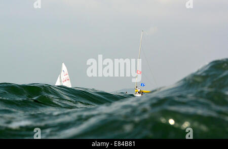 Incheon, South Korea. 30th Sep, 2014. A sailing boat competes during the 420 - men's two person dinghy match of sailing at the 17th Asian Games in Incheon, South Korea, Sept. 30, 2014. © Zhu Zheng/Xinhua/Alamy Live News Stock Photo