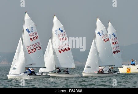 Incheon, South Korea. 30th Sep, 2014. Athletes compete during the 420 - men's two person dinghy match of sailing at the 17th Asian Games in Incheon, South Korea, Sept. 30, 2014. © Zhu Zheng/Xinhua/Alamy Live News Stock Photo