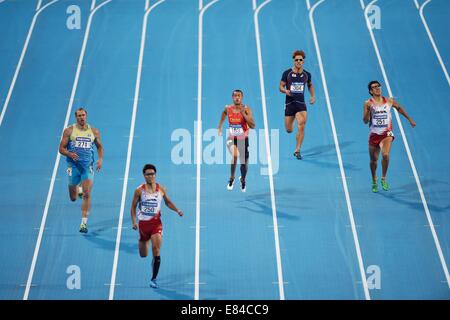 Incheon, South Korea. 30th Sep, 2014. Guo Qi (C) of China runs during the men's decathlon 100m match of athletics at the 17th Asian Games in Incheon, South Korea, Sept. 30, 2014. © Xie Haining/Xinhua/Alamy Live News Stock Photo