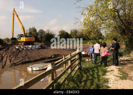 Burrowbridge, Somerset, UK. 30th September, 2014.  Byrony Sadler from the Flooding On The Level Action Group “FLAG” gives a media interview to an international crew as dredging continues along the River Parrett on the Somerset Levels. Stock Photo