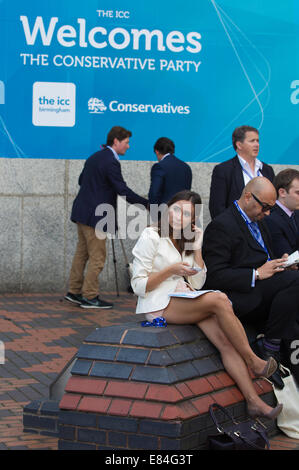 Birmingham, UK. 30th September, 2014. Conservative Party Conference, Birmingham, UK Picture shows party members enjoying the late September warm weather outside at the Conservative Party Conference at the ICC in Birmingham, UK Credit:  Clickpics/Alamy Live News Stock Photo