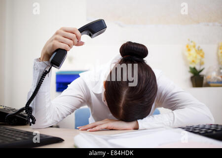 Young attractive business woman with phone in hand Stock Photo