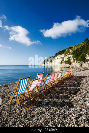 Row of deck chairs at the beach. Stock Photo