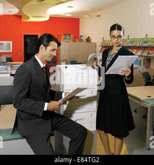 young workers using copy machine Stock Photo